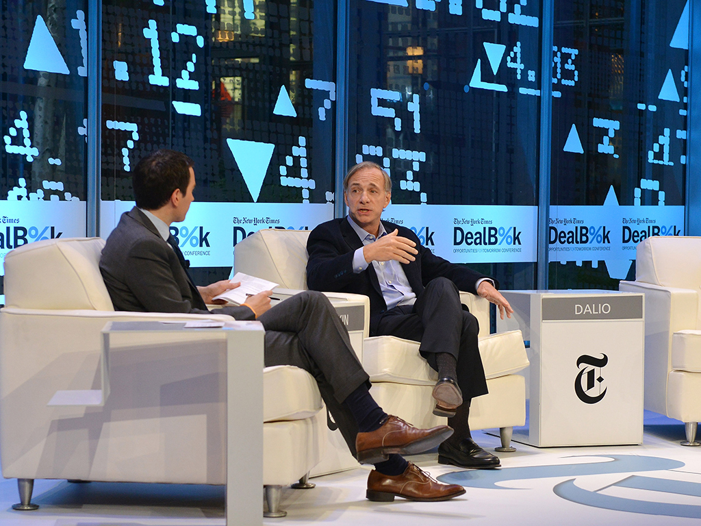 Journalist Andrew Ross Sorkin (L) and founder of Bridgewater Associates Ray Dalio participate in a discussion