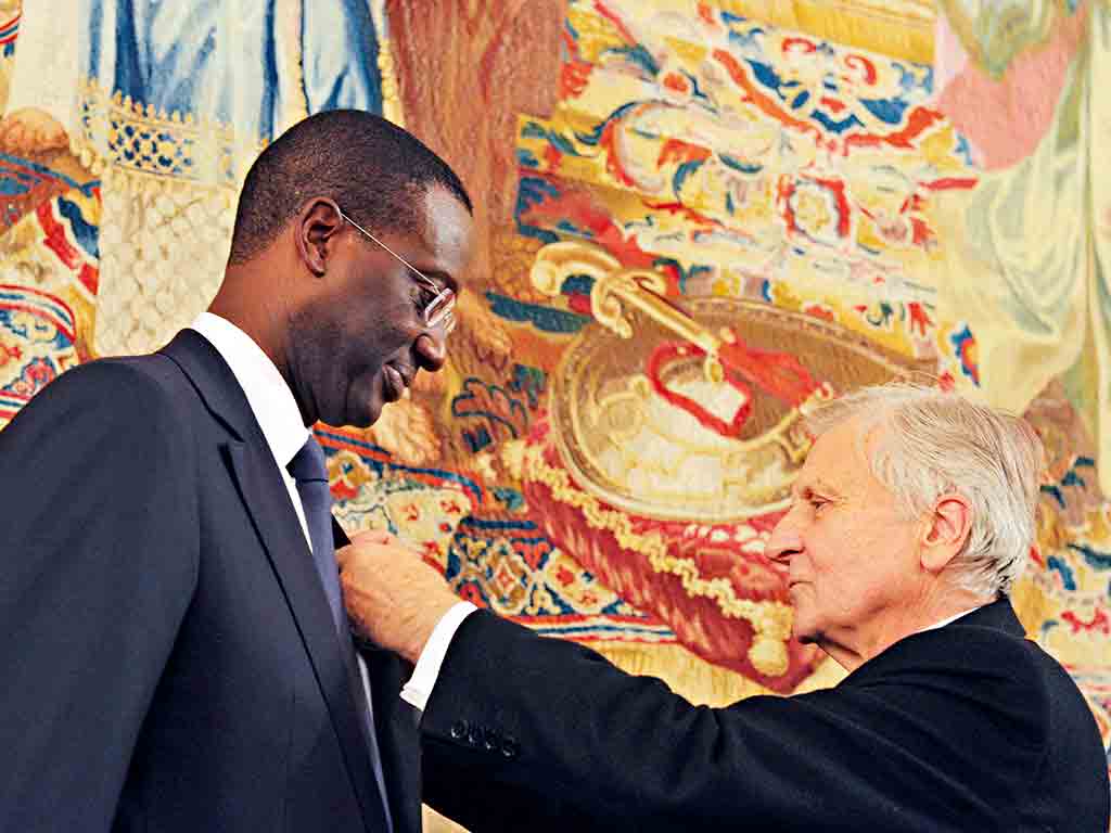 Tidjane Thiam being awarded with the French Legion of Honour by former European Central Bank president Jean-Claude Trichet