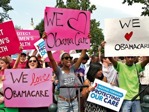 Obamacare supporters in Washington DC. Critics fear 43 million Americans will lose access to employer-based health insurance as a result of the system