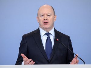 John Cryan, then-CEO of Deutsche Bank, speaking to the media about the company's €500m losses in 2017