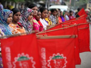Bangladeshi garment workers protest for better wages and compensation for victims of the Rana Plaza factory collapse