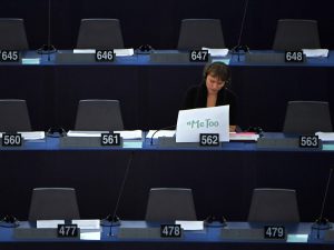 Swedish MEP Linnéa Engström displays a #MeToo placard at the European Parliament during a debate about combating sexual harassment and abuse in the EU